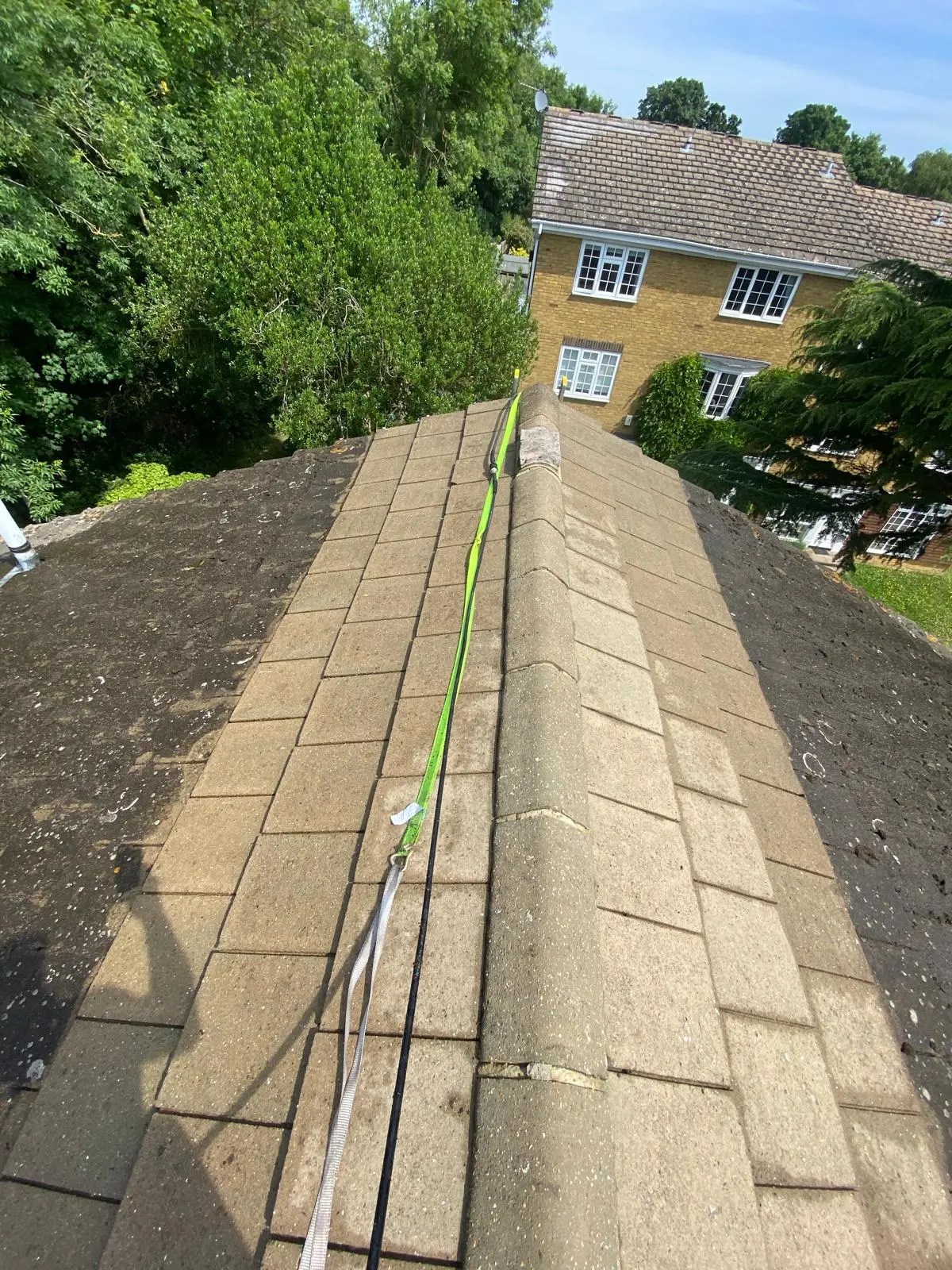 Diamond Gutters UK roof cleaning before and after using power washing on grey shingles