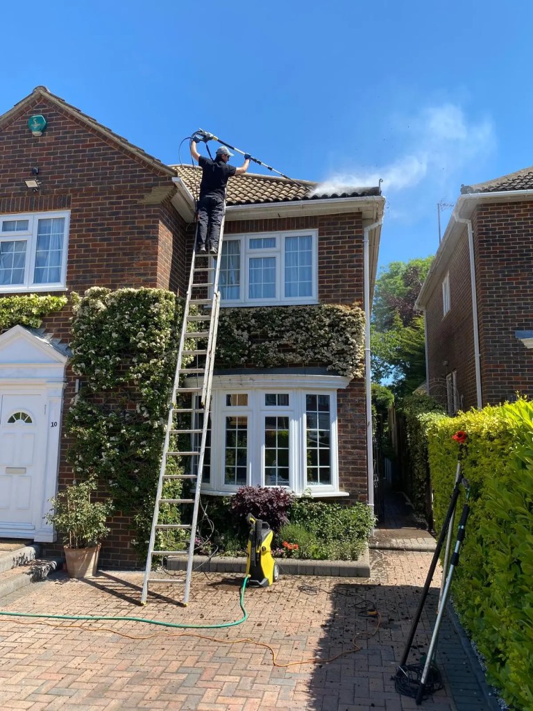 Diamond Gutters UK roof cleaning using pressure washing