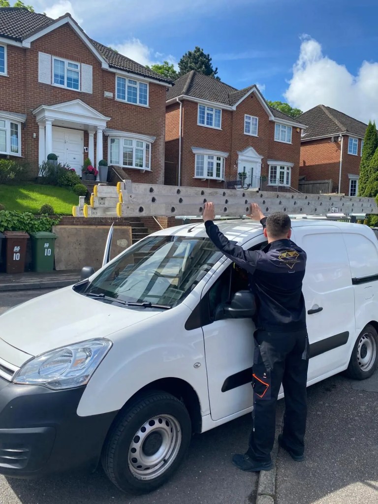 Diamond Gutters UK van with a technician unloading a ladder for roof and gutter cleaning services